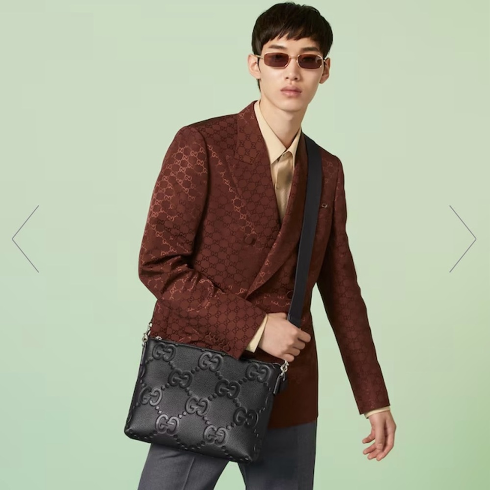 Gucci All Black leather GG embossed messenger bag
